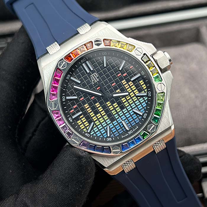 Reloj Audemars Piguet Royal Oak con diseño de ecualizador multicolor, bisel arcoíris y correa azul marino, estilo moderno y vibrante ideal para looks llamativos.
